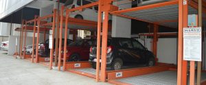 How does a Puzzle Parking System help ease space crunch?